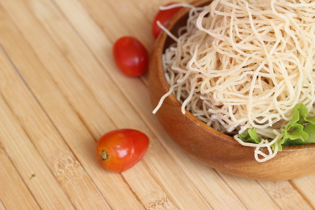 The basin is in a cup on a brown backgroundの写真素材