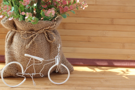 Yellow roses are arranged in bouquets on a brown backgroundの写真素材