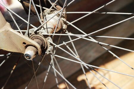 Old rusty bicycle wheel, brown islandの写真素材