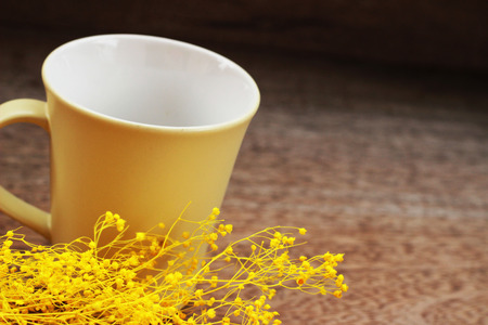 An empty coffee mug placed on a brown backgroundの写真素材