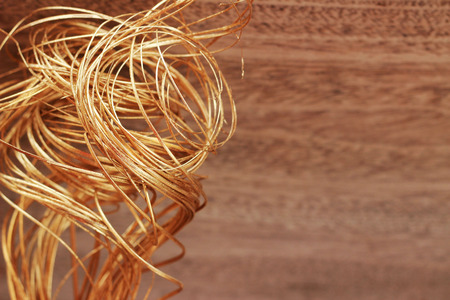 A brown grass bouquet is placed on a brown backgroundの写真素材