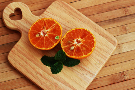 Orange juice blended and orange on a brown wooden tableの写真素材