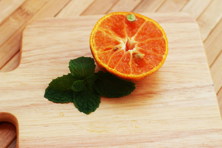 Orange juice blended and orange on a brown wooden tableの写真素材