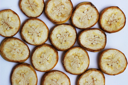 Ripe bananas are cut together on a white backgroundの写真素材