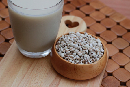 Coix lacryma-jobi, boiled in a glass on a brown backgroundの写真素材