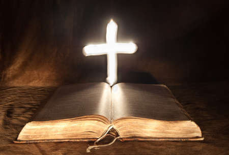 Mysterious Cross above Bible の写真素材