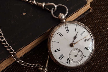 Pocket watch and old Bibleの写真素材