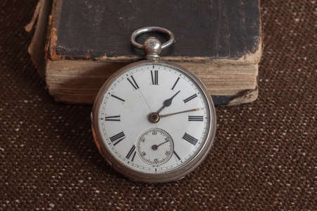Pocket watch and old Bibleの写真素材