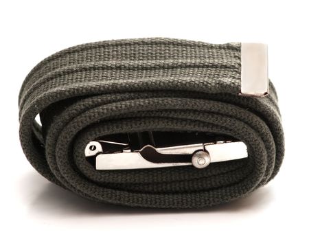 Green army belt with metal buckle on white background, rolled upの写真素材