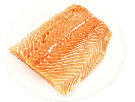Fresh salmon, big slize, isolated towards white backgroundの写真素材
