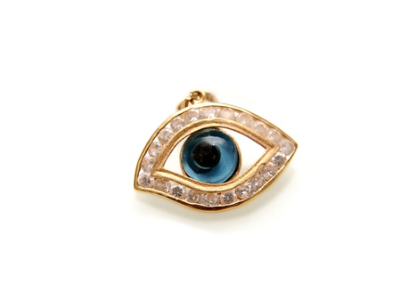 Evil eye with diamonds, and yellow gold, isolated towards white backgroundの写真素材