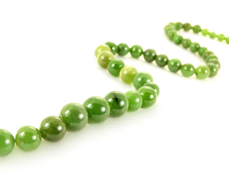 Green gemstone necklace, isolated towards white backgroundの写真素材
