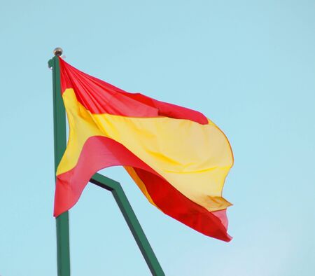 Flag of Spain against clear blue sky
