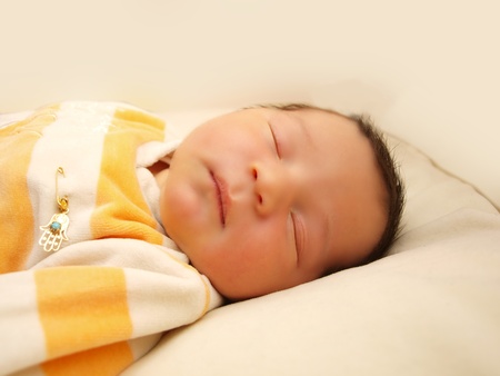 Newborn baby, infant, sleeping in it's bedの写真素材