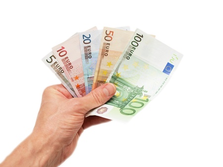 Euro currency bank notes, handed over, isolated towards white backgroundの写真素材