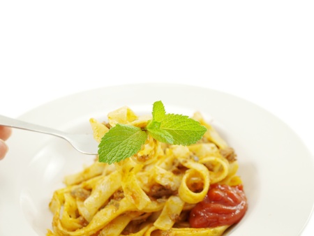 Pasta with meat sauce on towards white backgroundの写真素材