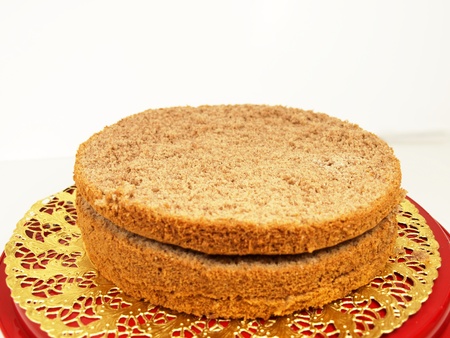 Chocolate layer cake, in slices, isolated on a golden paperの写真素材