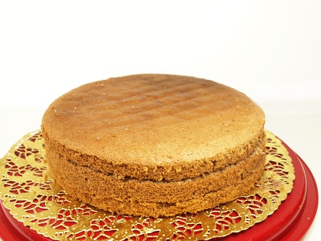 Chocolate layer cake, in slices, isolated on a golden paperの写真素材