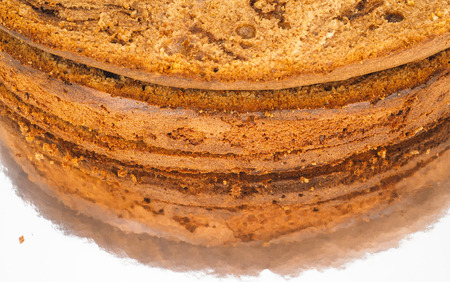 Closeup of freshly made chocolate cake base on silver mirror plateの写真素材