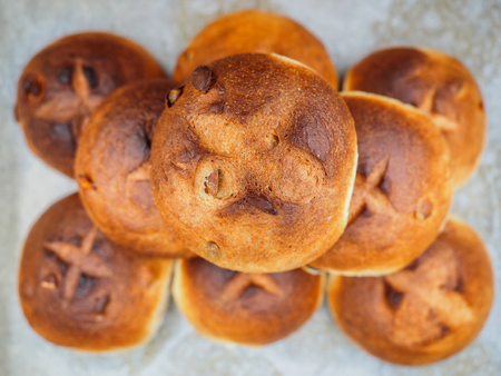 Pumkin seed buns on baking paper sfter baking at close-up in a nicely put pileの写真素材