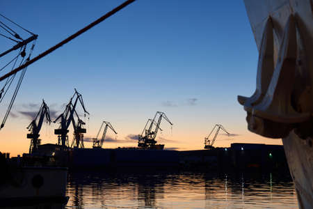 Cranes at the docks in sunsetの写真素材