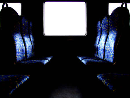 A light window in the train carriage with blue passenger seats