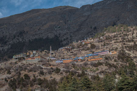 Upper Pisang mountain village in sunlight, trekking Annapurna circuit, Himalaya, Nepal, Asiaの写真素材