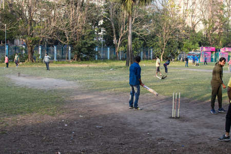 Kolkata, India - February 1, 2020: Several unidentified people plays cricket in everyday clothes in Minhaj Gardan park on February 1, 2020 in Kolkata, Indiaのeditorial素材