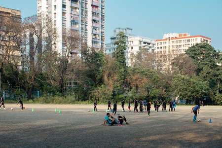 Kolkata, India - February 1, 2020: Several unidentified young people plays football at practice in...