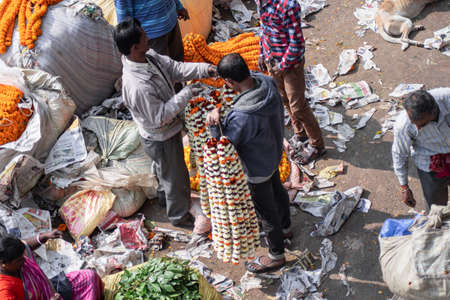 Kolkata, India - February 2, 2020: Unidentified people attends Mallick Ghat flower market by Howrah...