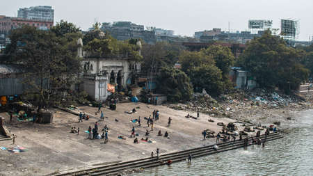 Kolkata, India - February 2, 2020: Unidentified people baths in Hooghly River by Ram Chandra Goenka...