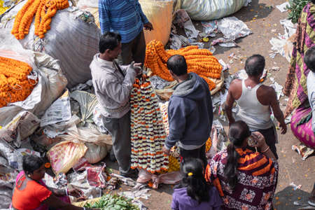 Kolkata, India - February 2, 2020: Unidentified people attends Mallick Ghat flower market by Howrah...