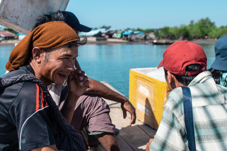 Chaung Thar, Myanmar - December 26, 2019: Portrait of unidentified men who chews gutka tobacco on a boat on December 26, 2019 in Chaung Thar, Myanmarのeditorial素材