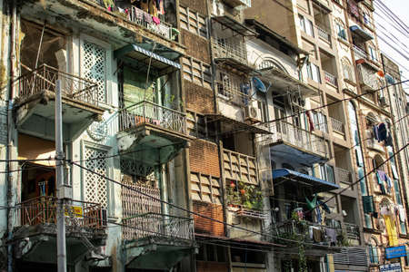 Exterior facade of an old residential apartment building in downtown central Yangon/Rangoon, Myanmar, Burmaの写真素材