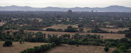 BAGAN, NYAUNG-U, MYANMAR - 3 JANUARY 2020: Looking out over the vast plains of Bagan with its historical temples and fields from the tall Nan Myint viewing towerのeditorial素材