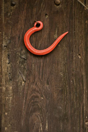 Old vintage hook on wooden backgroundの写真素材