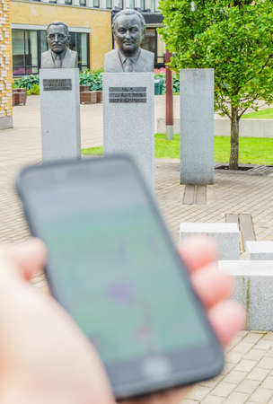 Estonia, Tallinn- JULY 23, 2016 : Walk with Pokemon Go game.  Apple iPhone 6 in one hand showing its...
