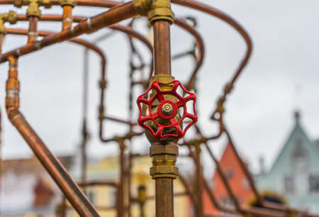 red valve on copper pipe (art construction)