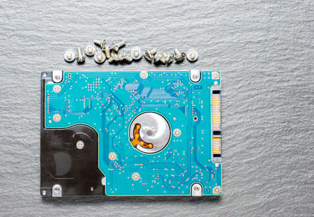 old  hard disk drive on black background