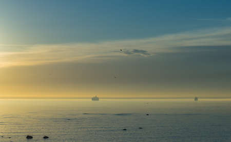 Sunset and boat on the seaの写真素材