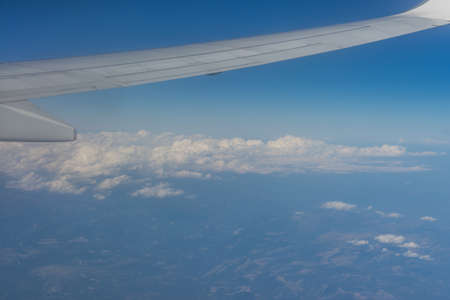 Airplane Wing in Flight from windowの写真素材