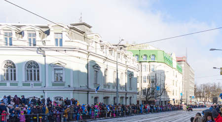 Tallinn, Estonia - February 24, 2018: Crowd of people celebrating 100 years of Estonia , in street...