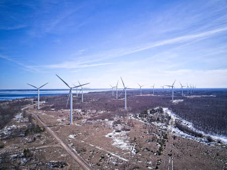 Green energy in winter time, Wind power stationsの写真素材