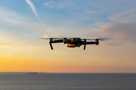 Estonia, Tallinn - June 15, 2018: Drone with camera flying over sea . The Mavic is a new drone design by DJIのeditorial素材