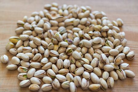 Mixed nuts on old wooden background