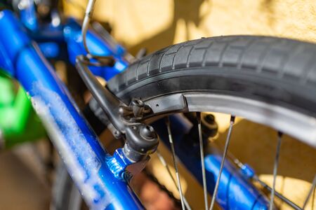 Bicycle tire spokes close up ride riding bike rubber brakes break braking valve.の写真素材