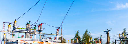 Panoramic view Electric power transmission lines in the evening. High voltage switchgear and...