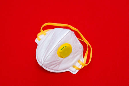 2019-nCoV, virus concept. protective respiratory flat lay mask. Red background.Copy space,mock up.の写真素材