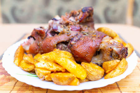Top view close up tasty pork shank and mashed potato on the plate closeup. Verticalの写真素材