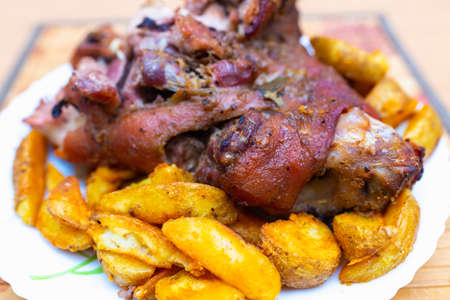 Top view close up tasty pork shank and mashed potato on the plate closeup. Verticalの写真素材